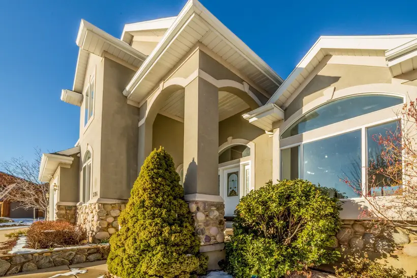 Stucco home with tall gables