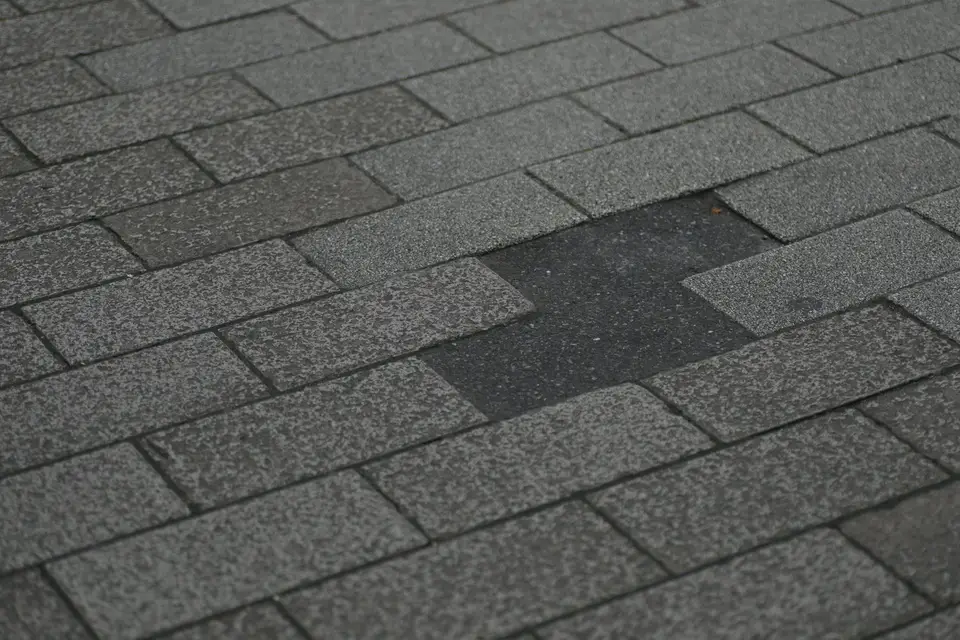 Asphalt shingle roof with missing shingles