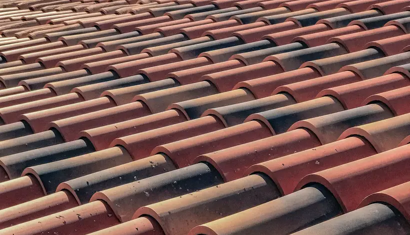 Rows of barrel clay roof tiles